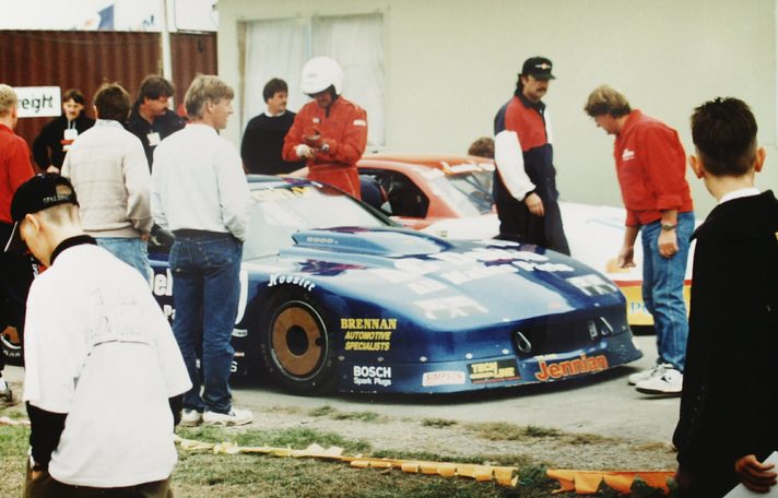Bruce Jenner and Paul Williams with the blue AC Delco Camaro in a New Zealand paddock