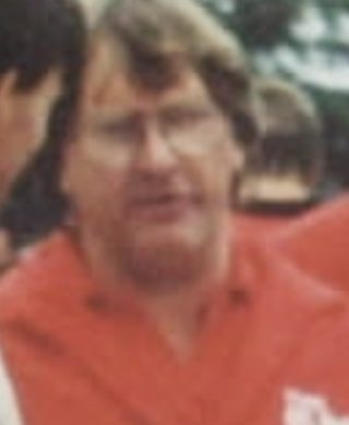 Bruce Jenner in a red team jacket at Ruapuna
